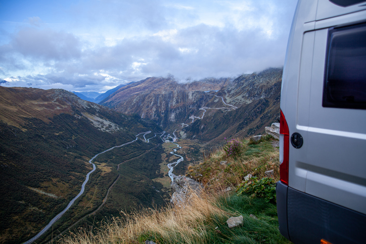 Adventurous camper van journeying on the mountain road