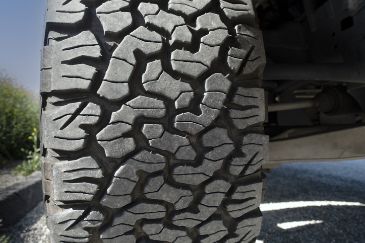 A close up of offroad tire tread on 4x4 truck