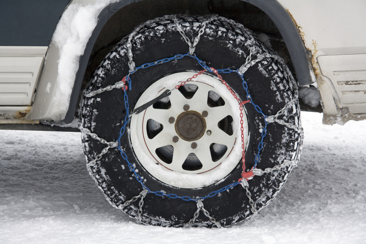 Snow chains on the tire of a 4X4 vehicle