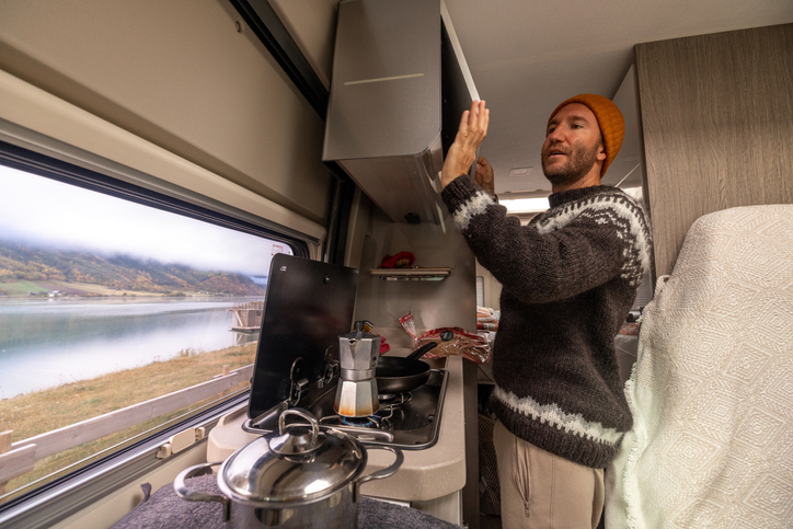 Man cooking in an RV