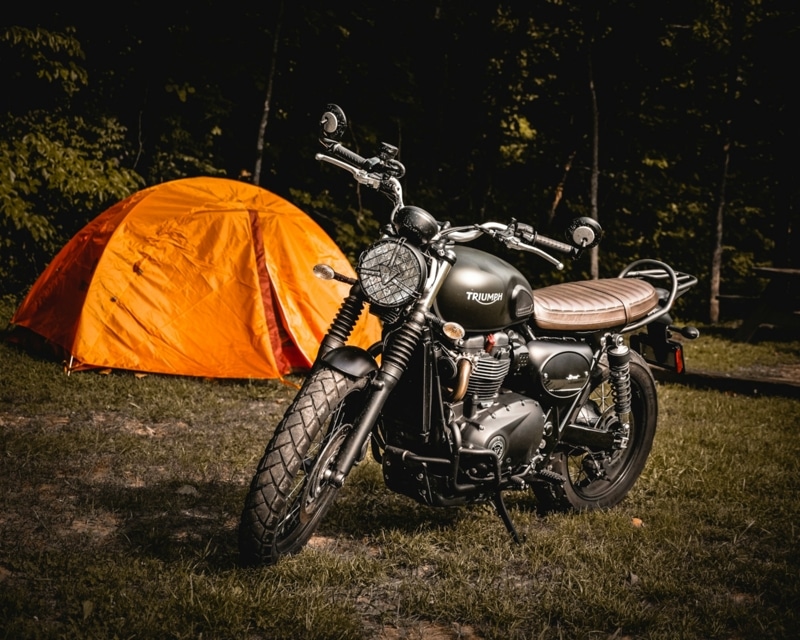 Motorcycle next to a tent