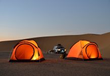Two orange tents in the desert evening light, near Dongola, Northern State, Nubia, Sudan