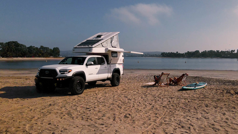 truck camper bed by Campluxe Cabovers at the beach